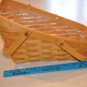 Longaberger Angled basket with swing handles, and plastic protector.